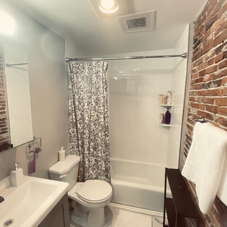 34 Hancock Street, Unit 1D Boston, MA 02114 - Photo 10 of 10 a bathroom with a shower a toilet and a sink