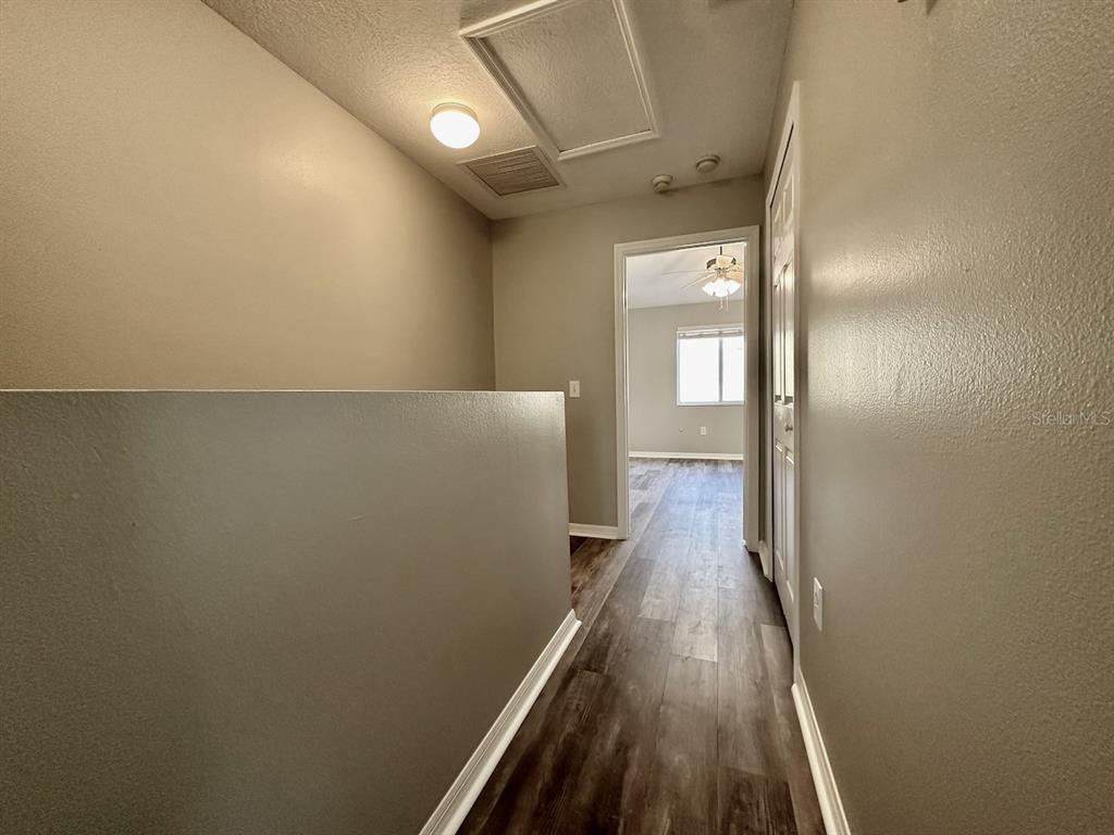 8532 Brushleaf Way Tampa, FL 33647 - Photo 12 of 20 a view of a hallway with wooden floor