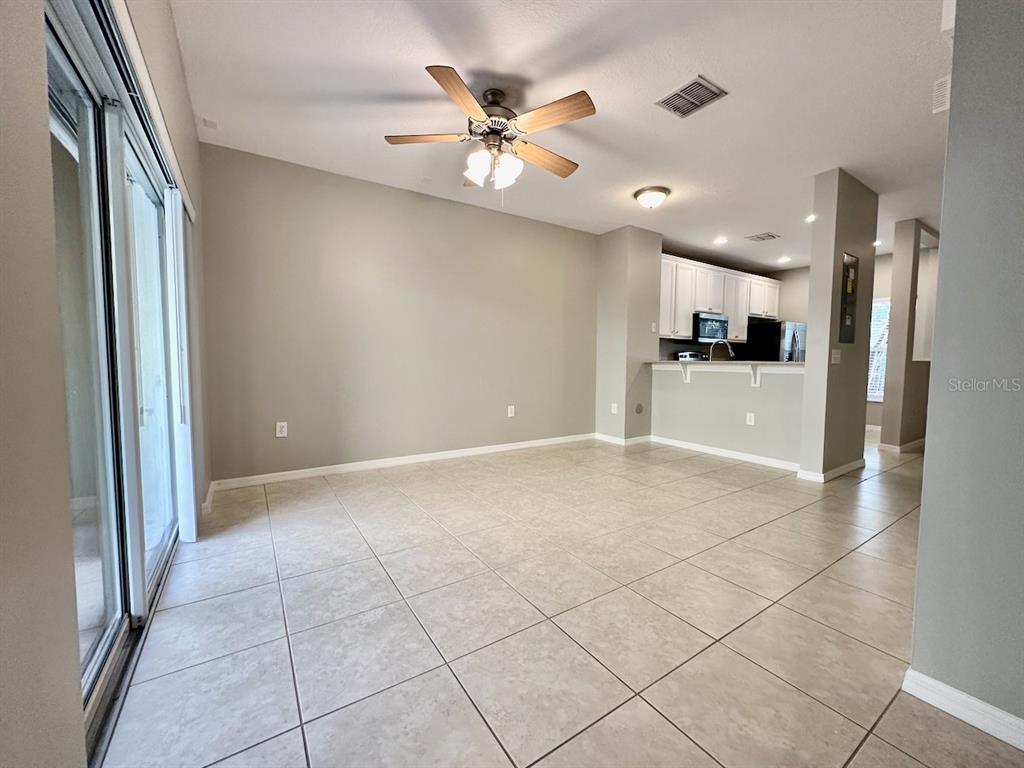 8532 Brushleaf Way Tampa, FL 33647 - Photo 6 of 20 a view of a livingroom with a ceiling fan and window