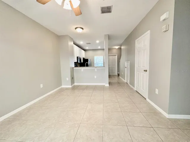 a view of kitchen with stainless steel appliances a refrigerator and a stove top oven