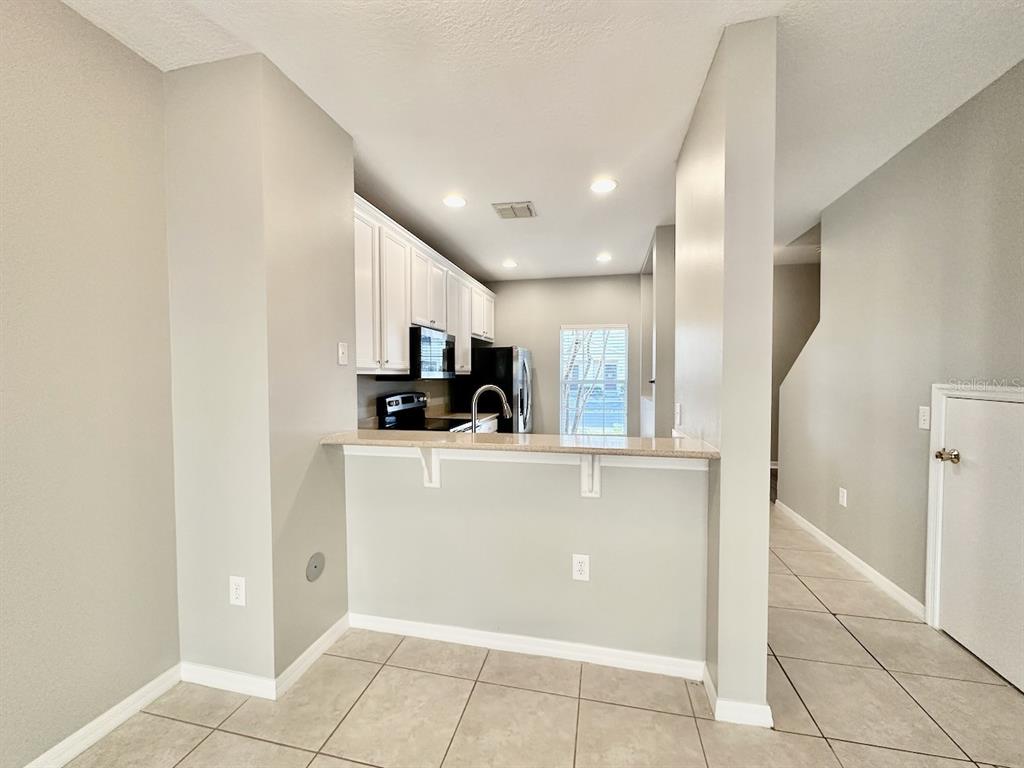 8532 Brushleaf Way Tampa, FL 33647 - Photo 8 of 20 a view of kitchen with stainless steel appliances a refrigerator and a stove top oven