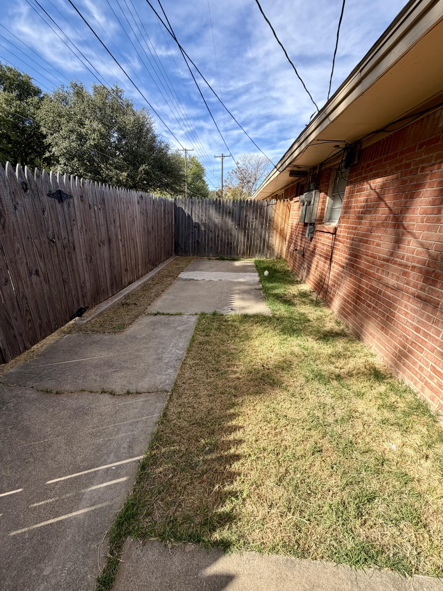 3813 51st Street, Unit A Lubbock, TX 79413 - Photo 16 of 17 a view of a backyard