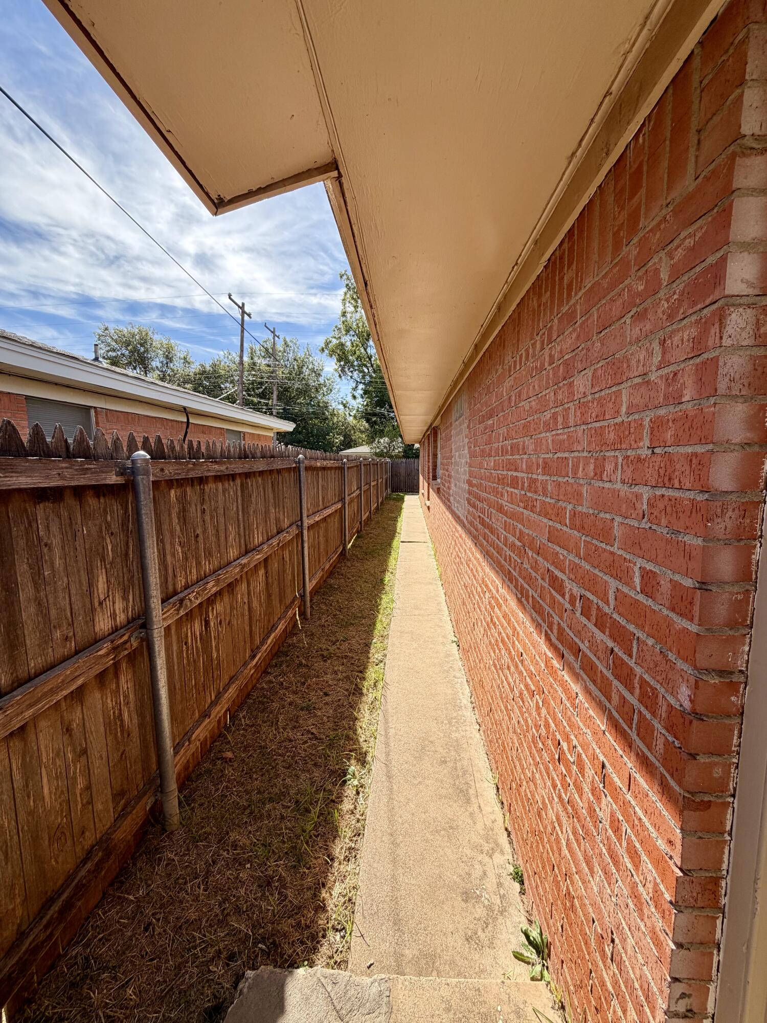 3813 51st Street, Unit A Lubbock, TX 79413 - Photo 17 of 17 a view of balcony with wooden floor and fence