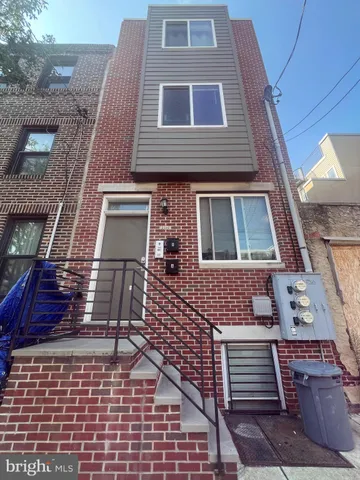 a building view with a brick wall