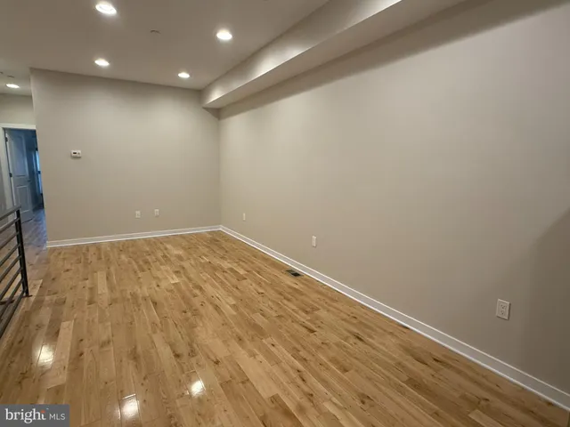 a view of room with wooden floor