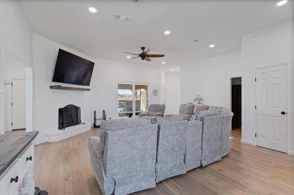 6514 Old Clarksville Road Reno, TX 75462 - Photo 11 of 27 a living room with furniture and a flat screen tv