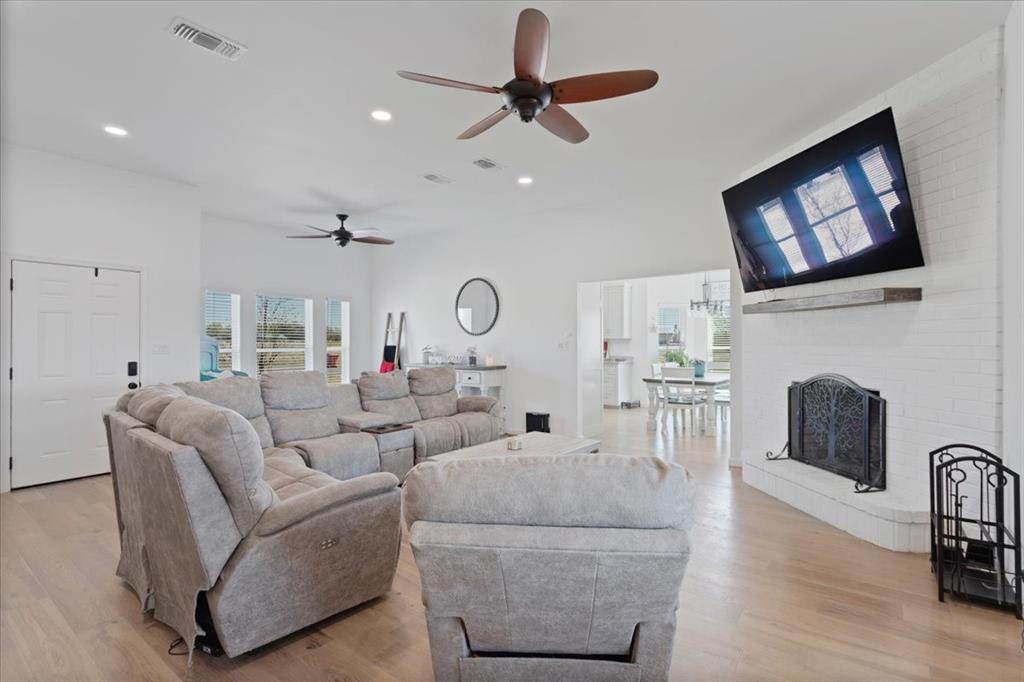 6514 Old Clarksville Road Reno, TX 75462 - Photo 13 of 27 a living room with furniture and a fireplace