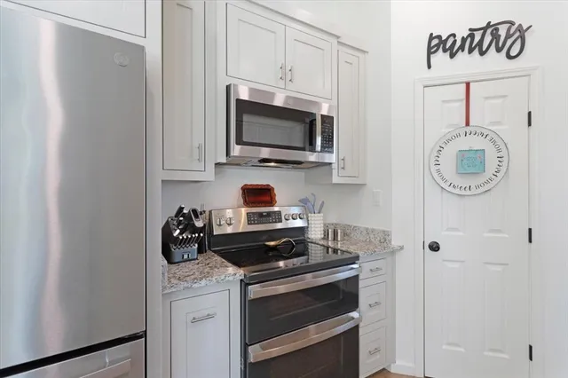 a kitchen with a stove and a microwave