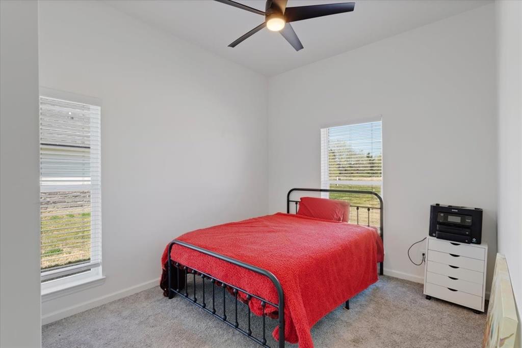 6514 Old Clarksville Road Reno, TX 75462 - Photo 26 of 27 a bedroom with a bed and a window