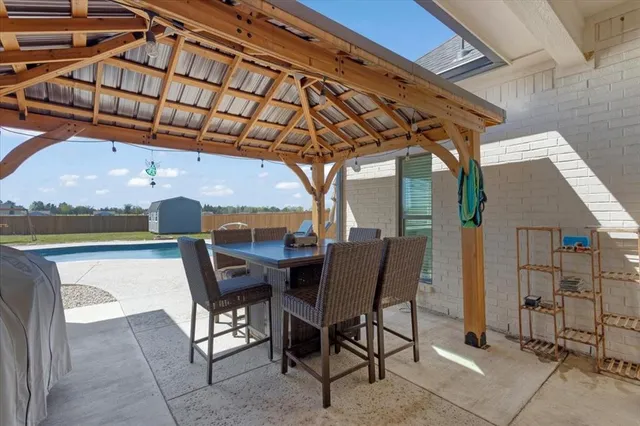 a view of a chairs and table in the patio
