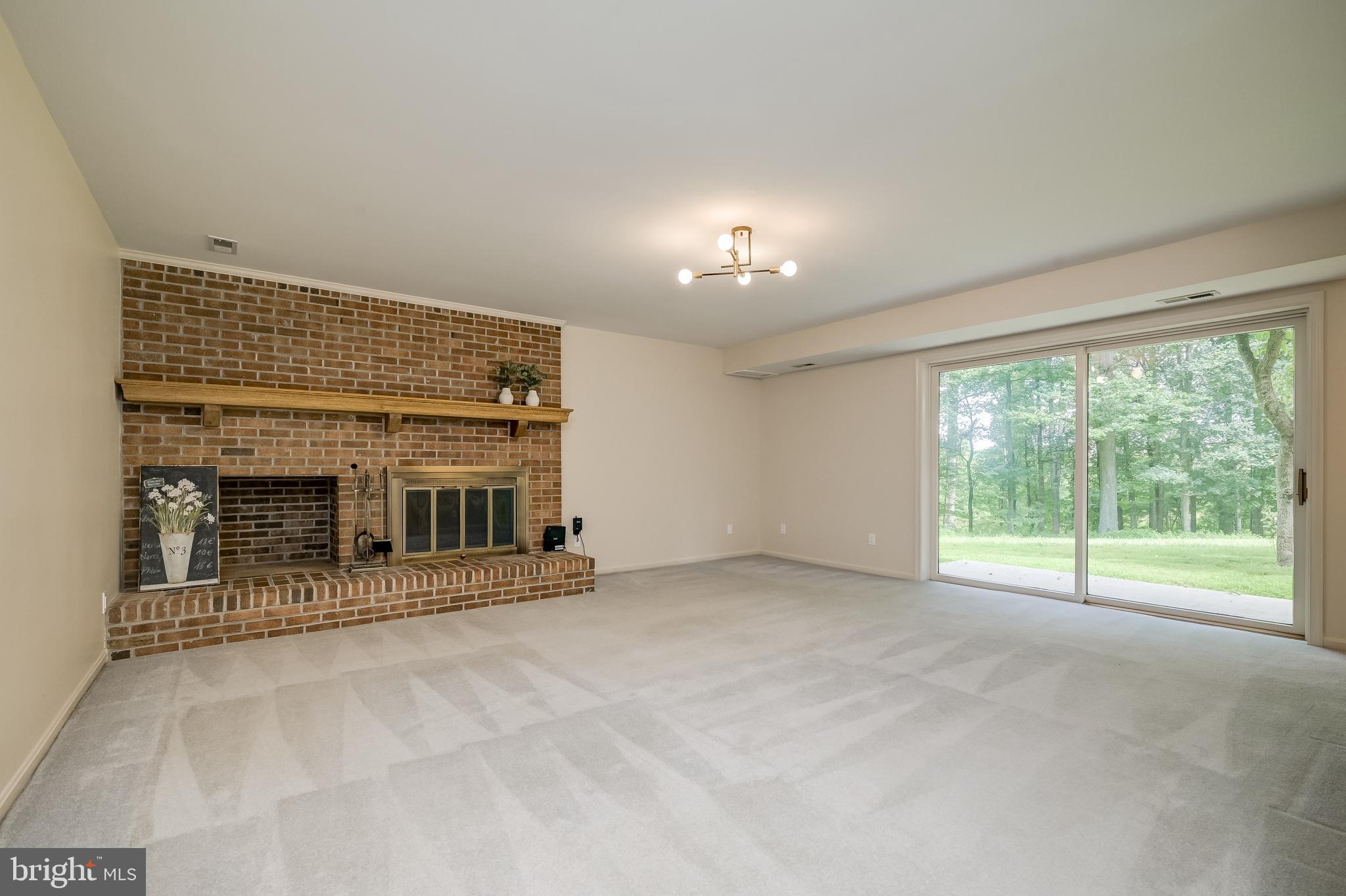 14048 Howard Road Dayton, MD 21036 - Photo 18 of 42 Large family room with access to patio