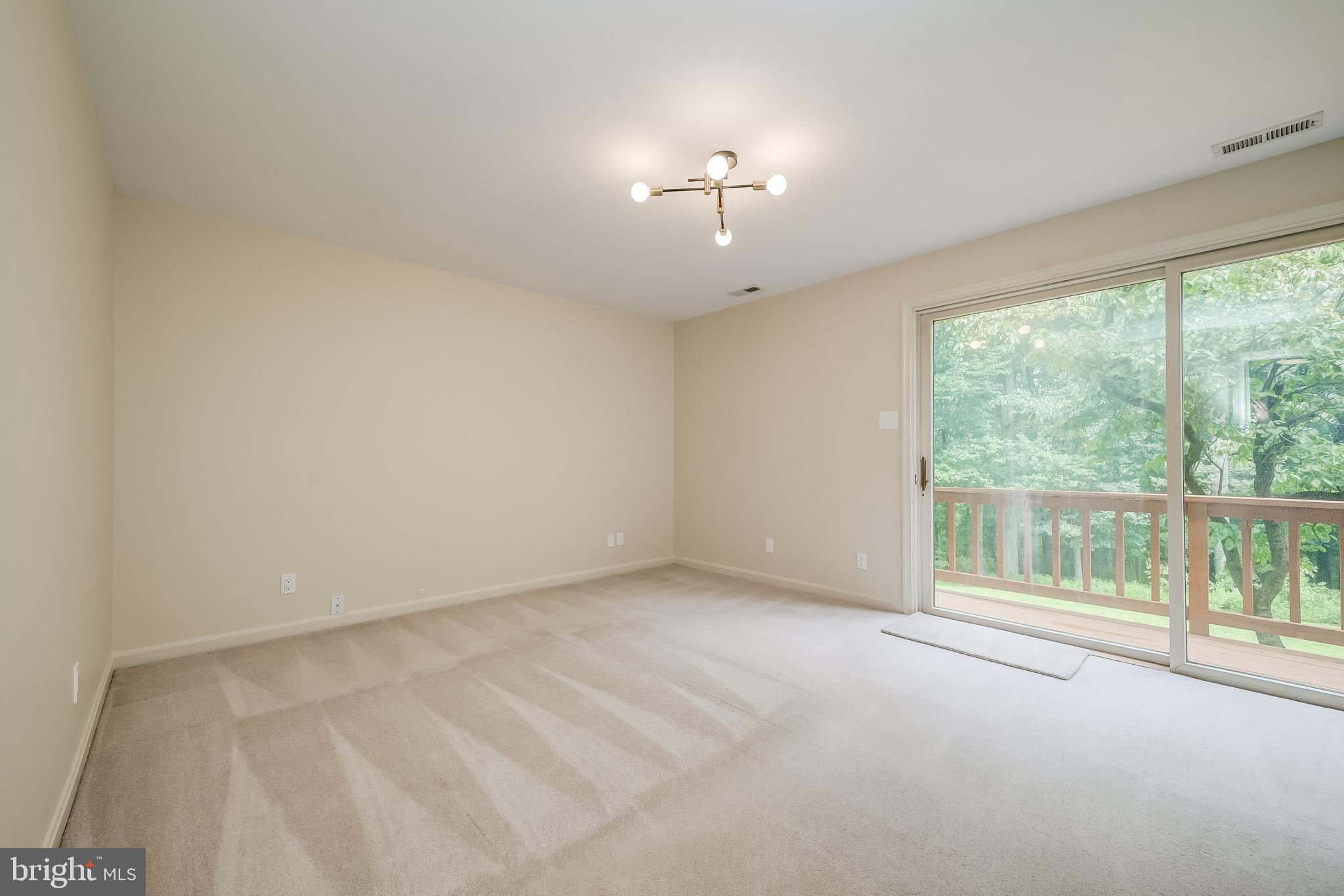 14048 Howard Road Dayton, MD 21036 - Photo 21 of 42 Primary bedroom with access to balcony