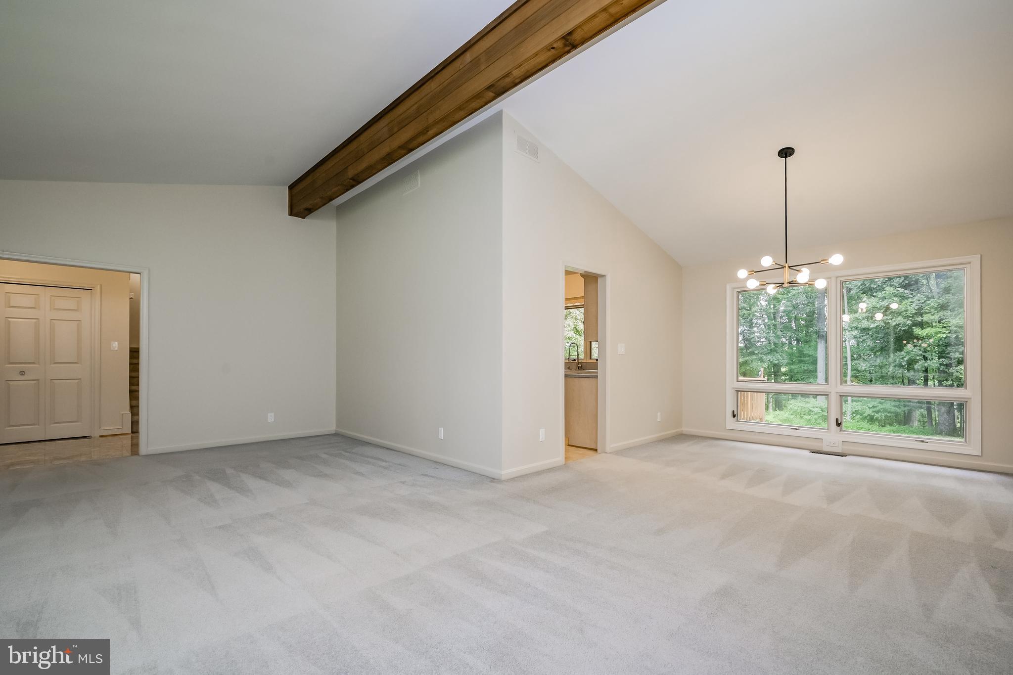 14048 Howard Road Dayton, MD 21036 - Photo 7 of 42 Living and dining rooms with cathedral ceilings