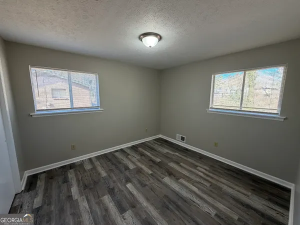 an empty room with windows