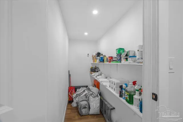 a view of a kitchen counter space and wooden floor