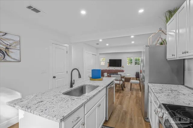 a bedroom with furniture and a fireplace