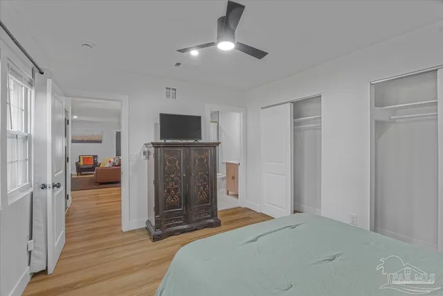 a bed room with a bed and a lamp