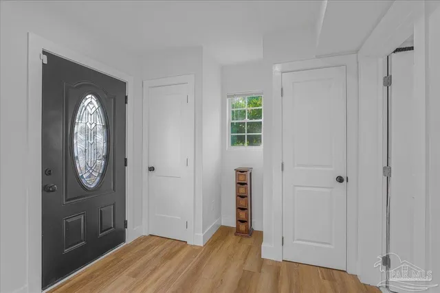 a view of backyard of house with trees