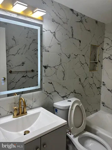 a bathroom with a sink and a toilet