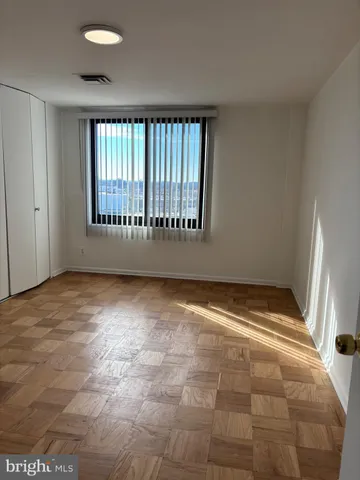 a view of an empty room with a window