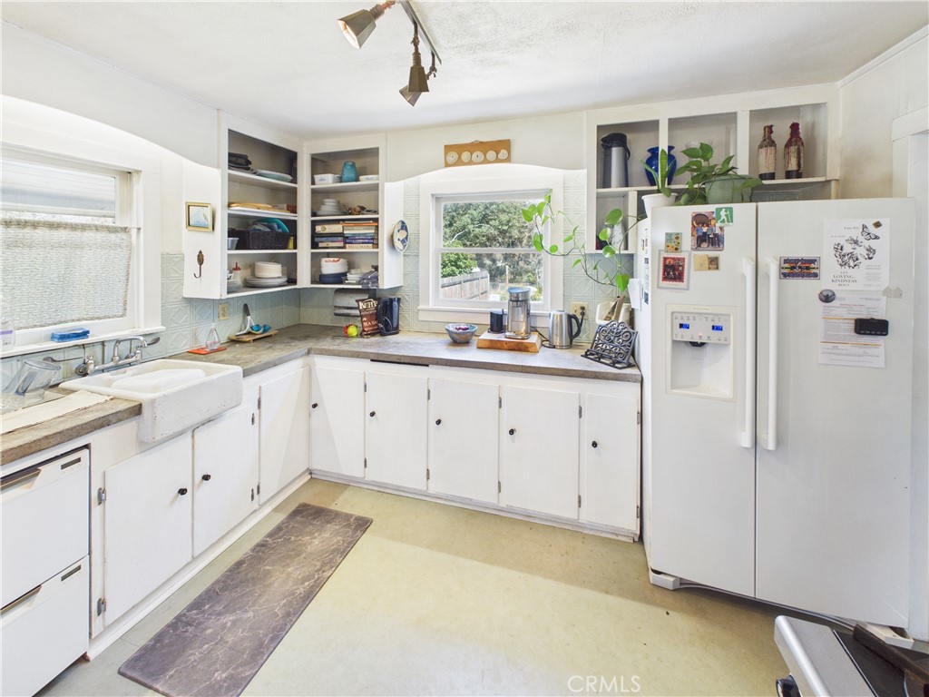4208 Ramsden Road Mariposa, CA 95338 - Photo 11 of 42 a kitchen with white cabinets and white appliances
