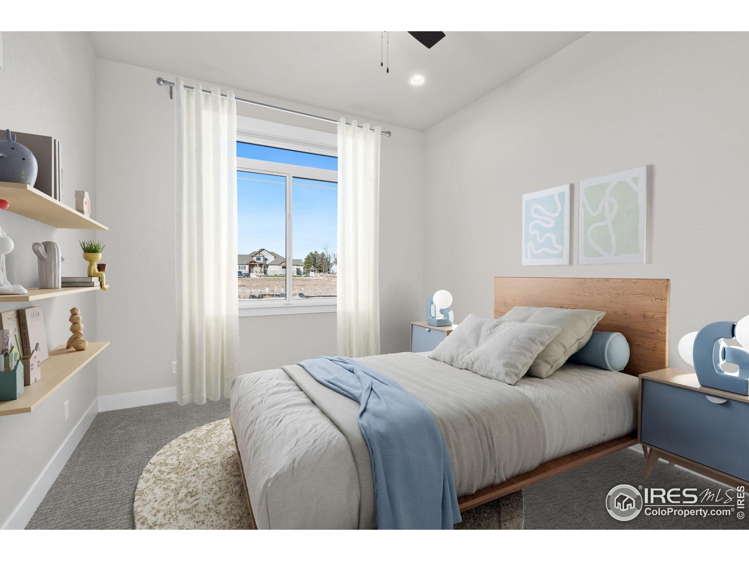 1369 Burt Avenue Berthoud, CO 80513 - Photo 20 of 41 a bedroom with a bed and a window