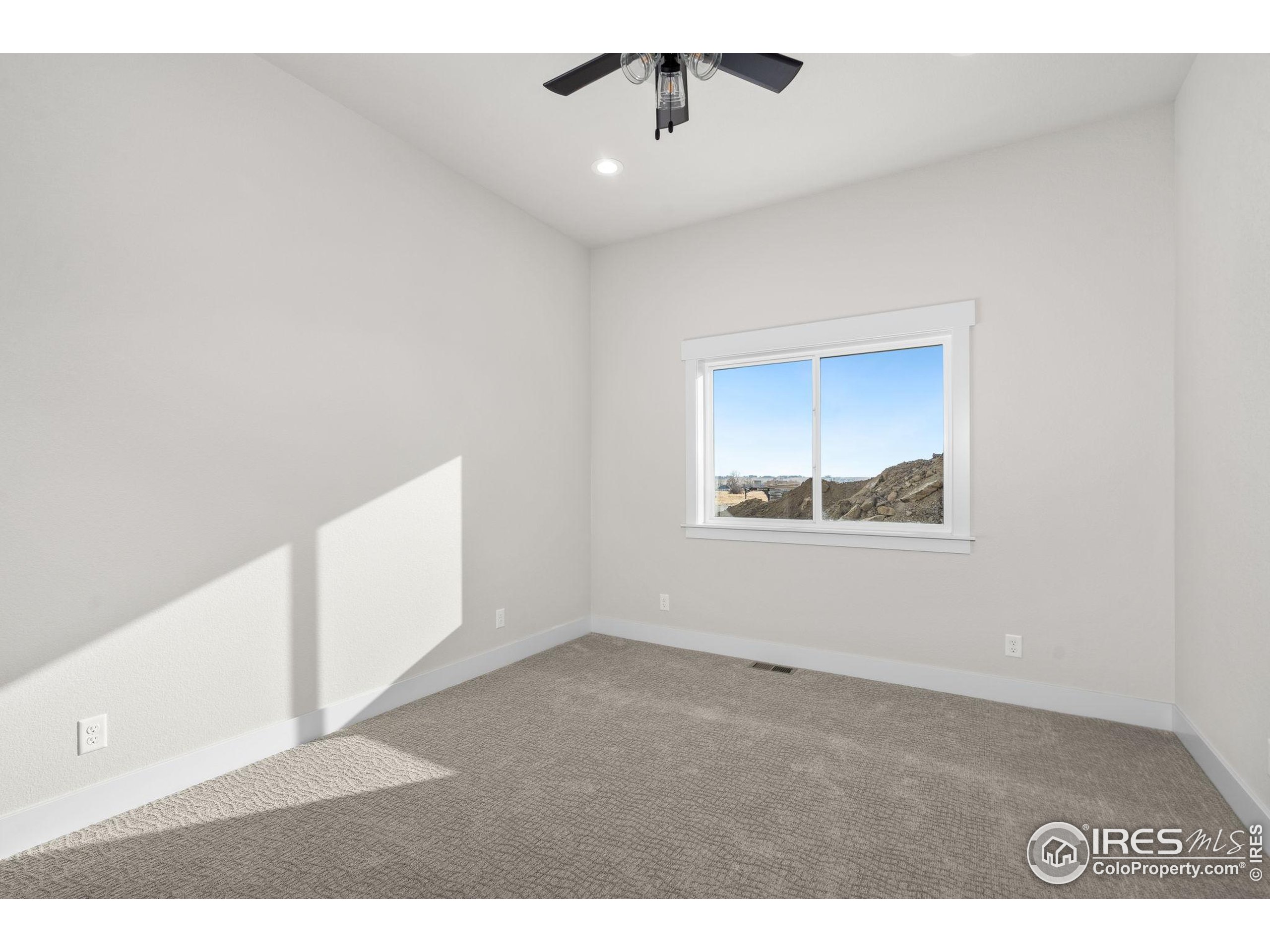 1369 Burt Avenue Berthoud, CO 80513 - Photo 24 of 41 a view of an empty room with a window
