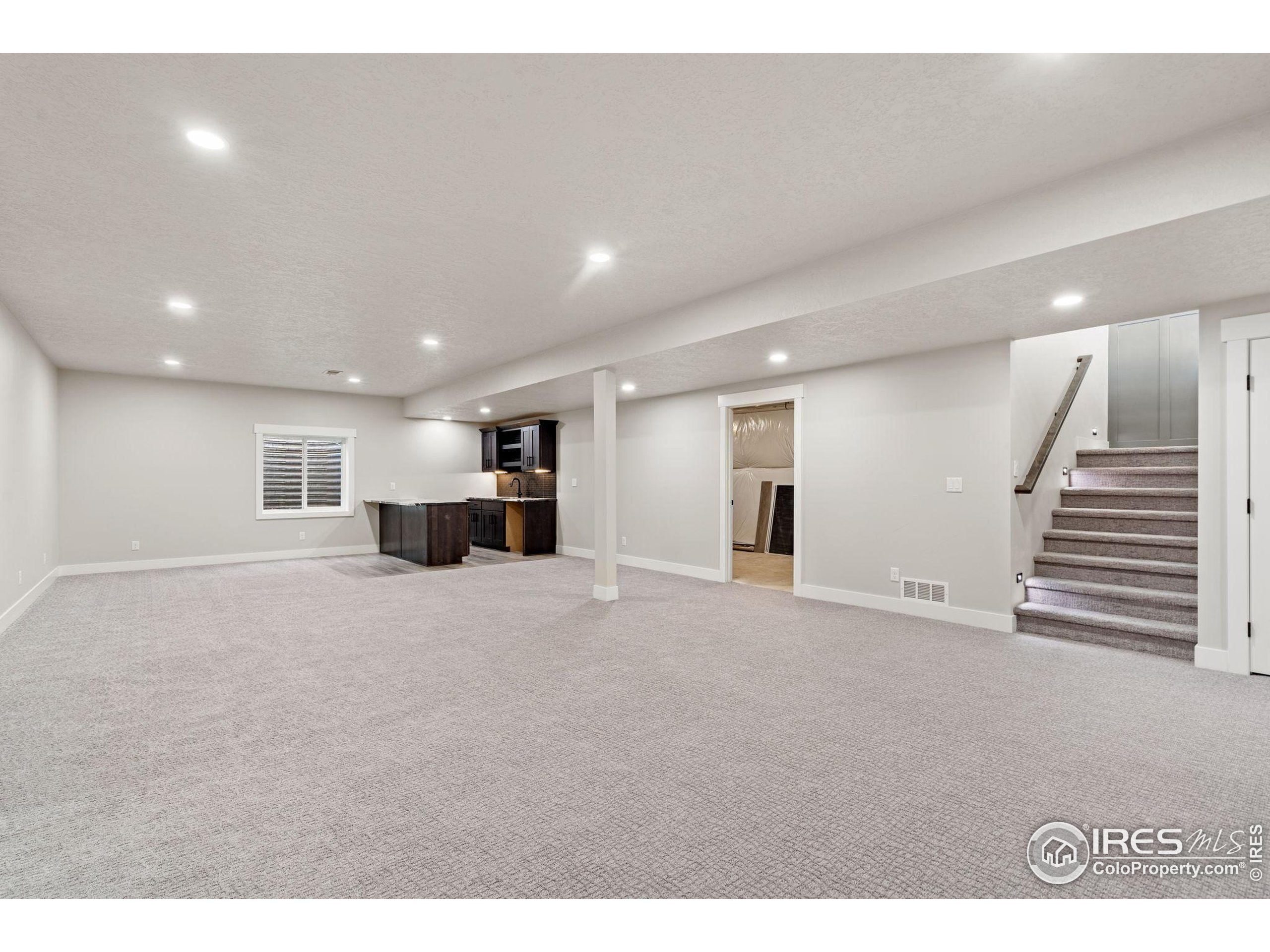 1369 Burt Avenue Berthoud, CO 80513 - Photo 28 of 41 a view of empty room with wooden floor