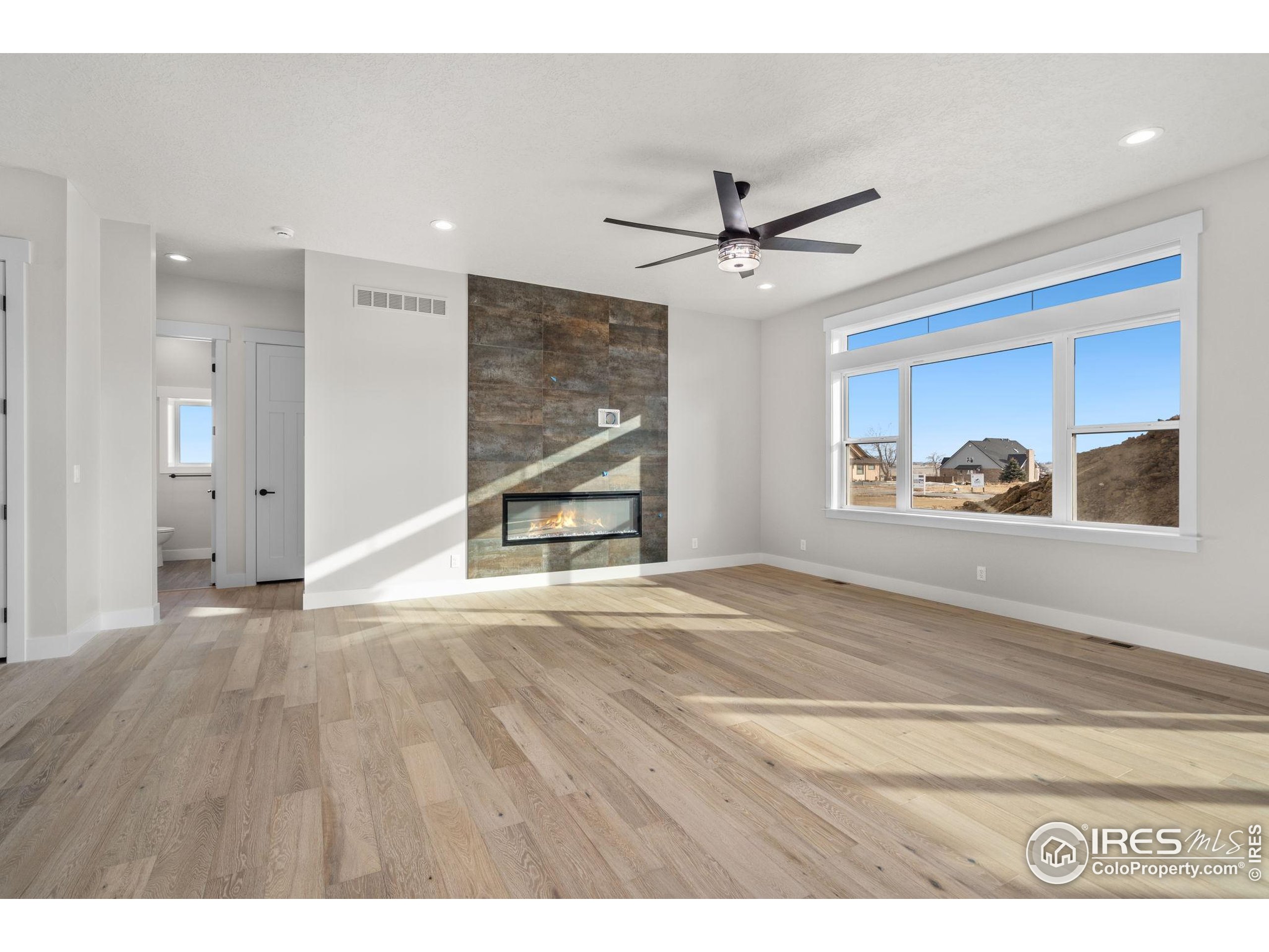 1369 Burt Avenue Berthoud, CO 80513 - Photo 3 of 41 a view of an empty room with a window and workspace
