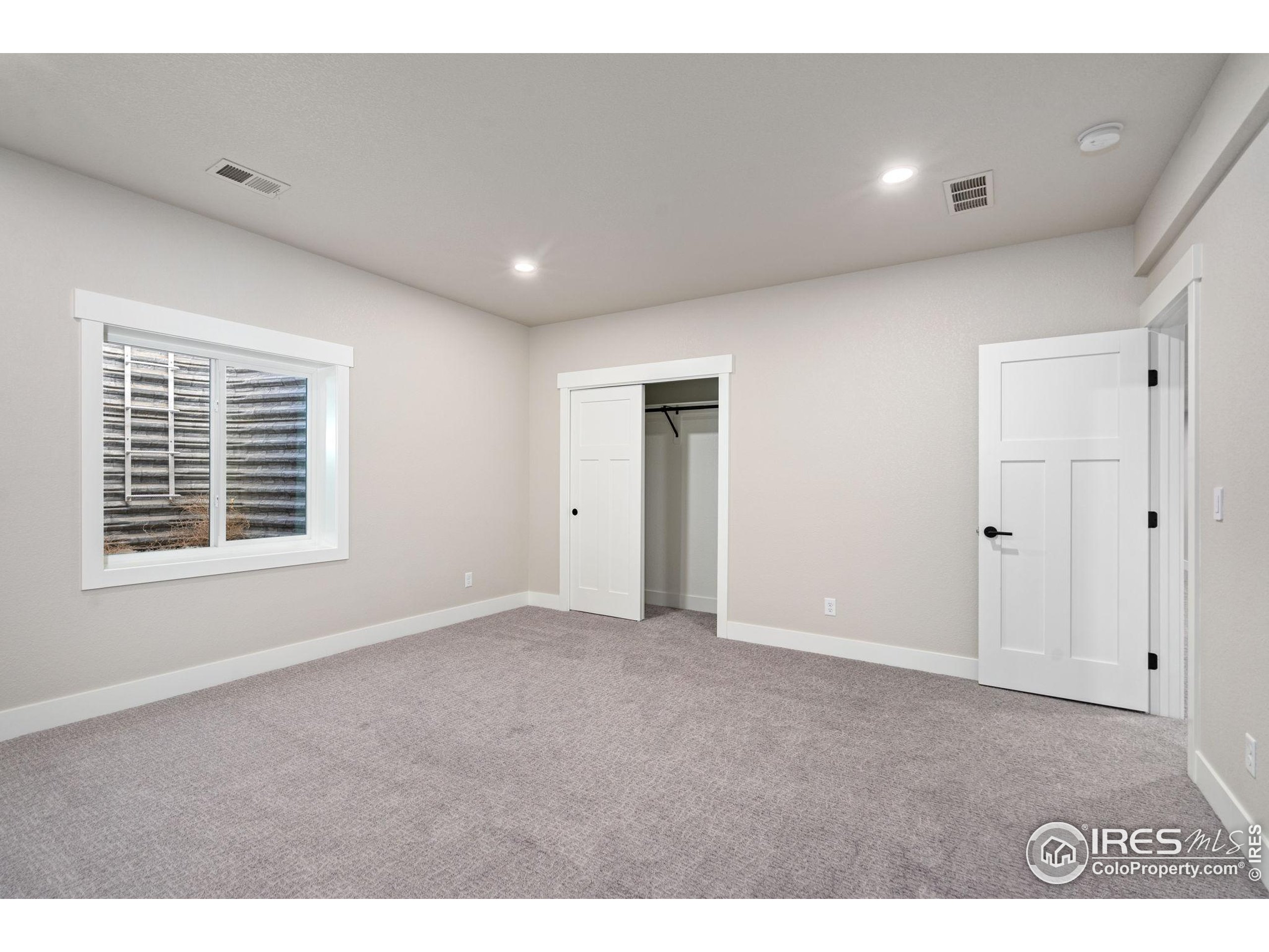 1369 Burt Avenue Berthoud, CO 80513 - Photo 35 of 41 a view of an empty room with a window