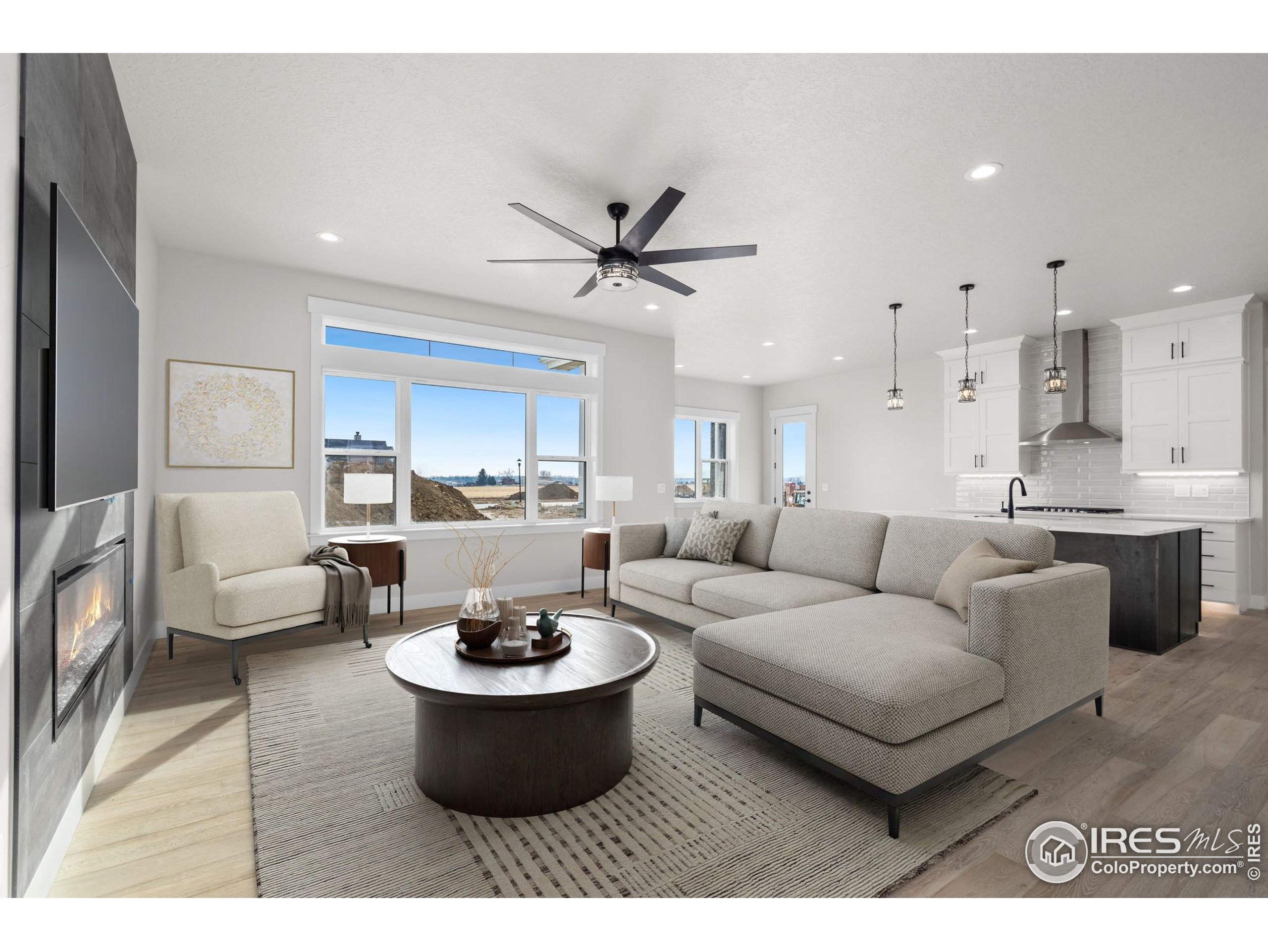 1369 Burt Avenue Berthoud, CO 80513 - Photo 5 of 41 a living room with furniture and a large window