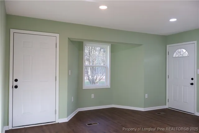 a room with furniture and mirror