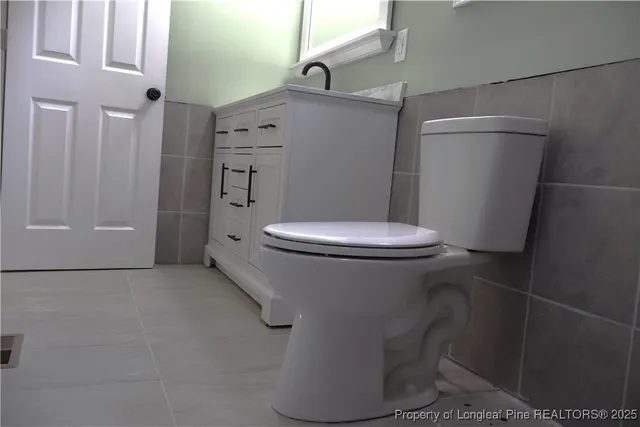 a view of a house with a backyard and a garage