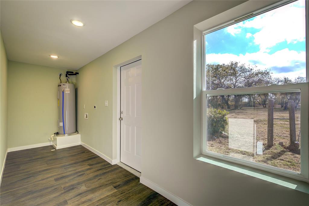 520 North 1st Street Point, TX 75472 - Photo 26 of 34 a view of hallway with wooden floor and a window