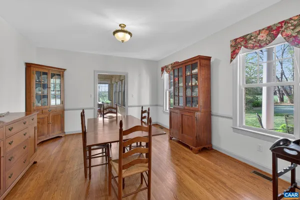 a view of a dining room with furniture window and wooden floor