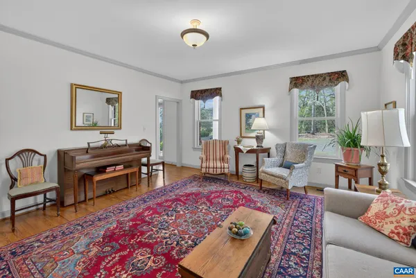 a living room with furniture and a rug
