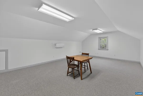 a kitchen with cabinets stainless steel appliances and a window