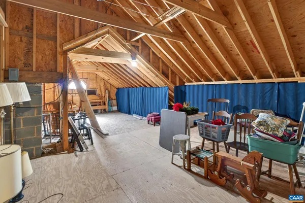 a view of an empty room with a ceiling fan