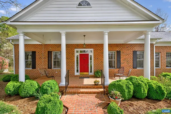 a front view of a house with garden