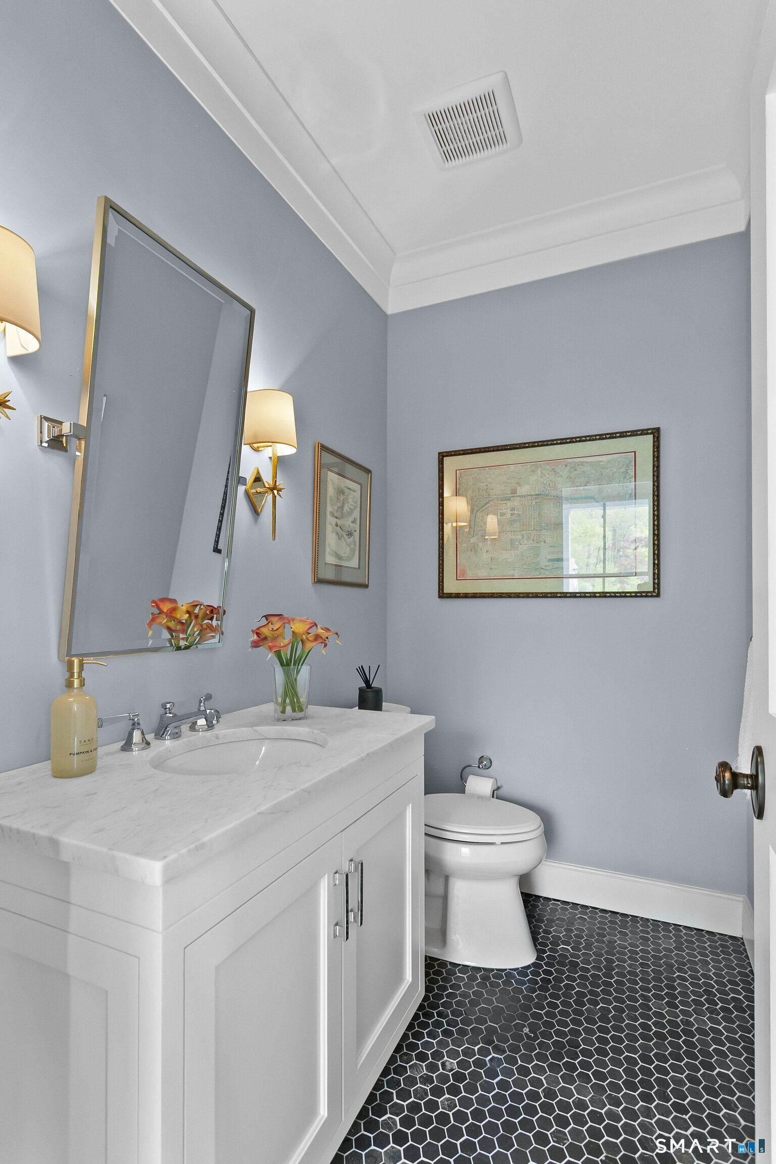 3007 Redding Road Fairfield, CT 06824 - Photo 19 of 40 a bathroom with a sink a toilet and mirror