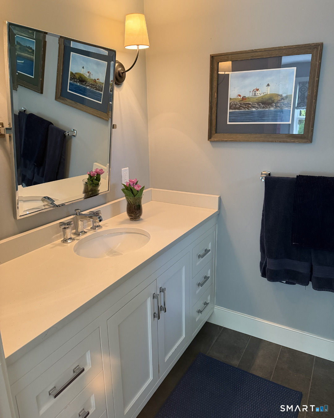 3007 Redding Road Fairfield, CT 06824 - Photo 25 of 40 a bathroom with a sink and a mirror