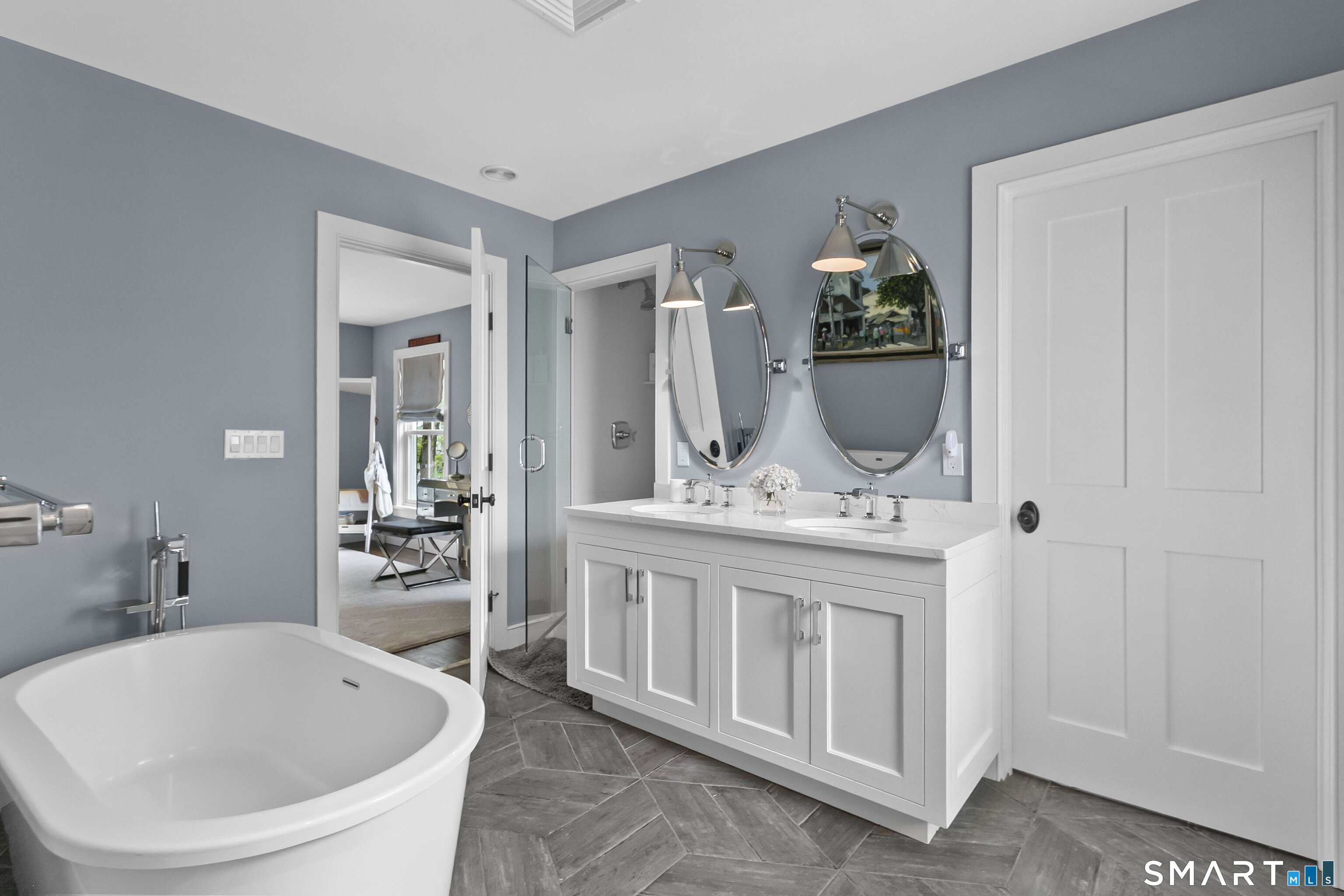 3007 Redding Road Fairfield, CT 06824 - Photo 27 of 40 a bathroom with a bathtub sink and mirror