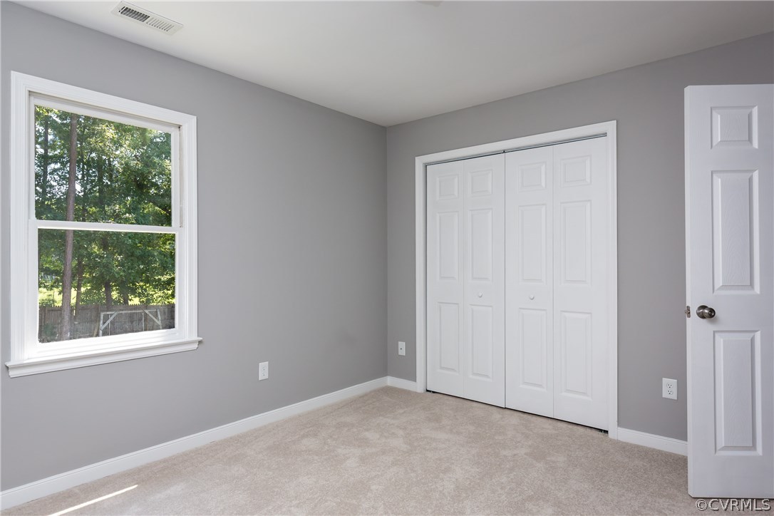 7613 Genuine Risk Lane Midlothian, VA 23112 - Photo 25 of 36 an empty room with windows