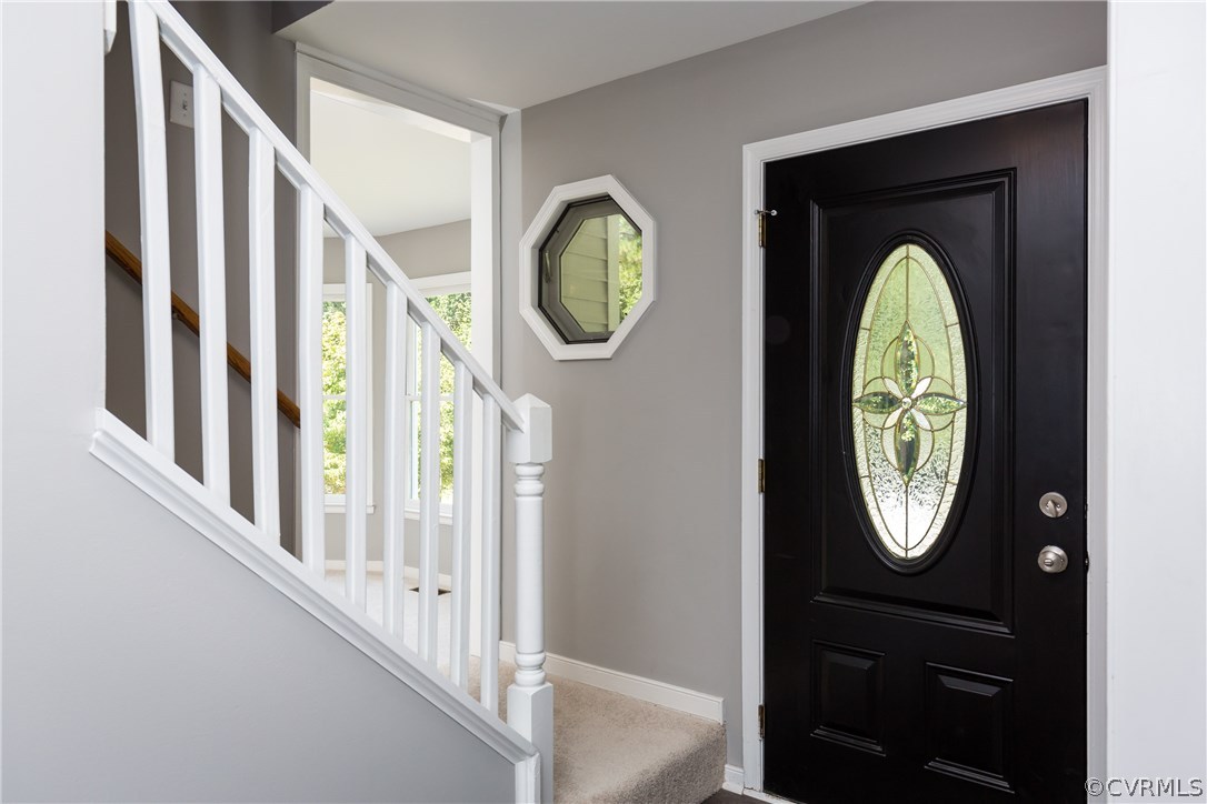 7613 Genuine Risk Lane Midlothian, VA 23112 - Photo 4 of 36 a view of a entryway with wooden door