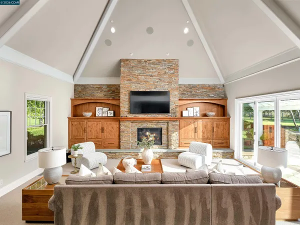 a living room with furniture and a fireplace