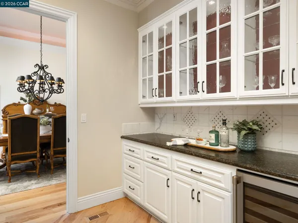 a room with pool table and windows