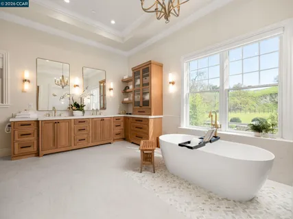 a very nice looking dining room with a large window