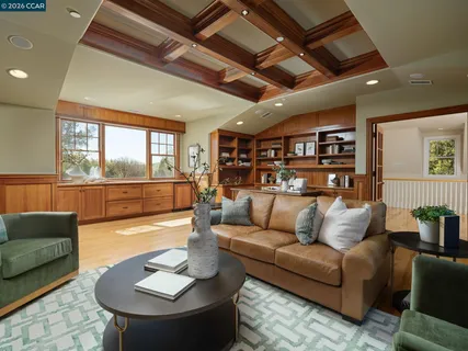 a kitchen with a table chairs sink and cabinets