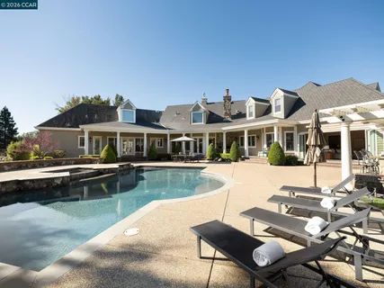 a view of a house with swimming pool