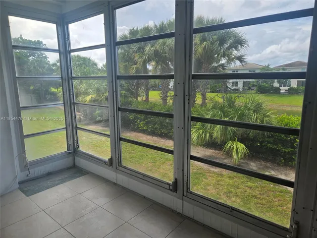 a view of a chairs and table in the garden